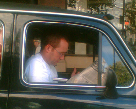 A candid camera shot of a cabbie