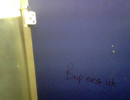 BNP advert on a toilet door